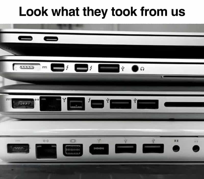 Stacked laptops with various ports and the text 'Look what they took from us'.