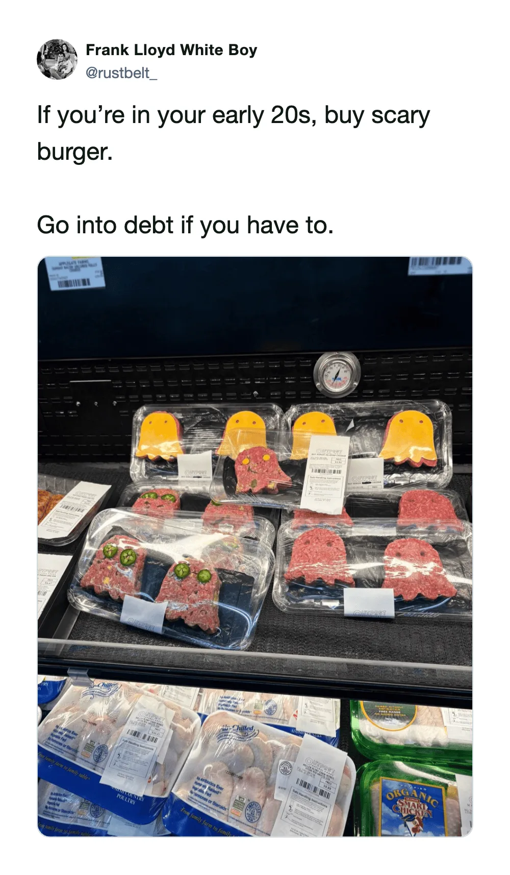 Display of packaged raw meat and burger patties in a grocery store.