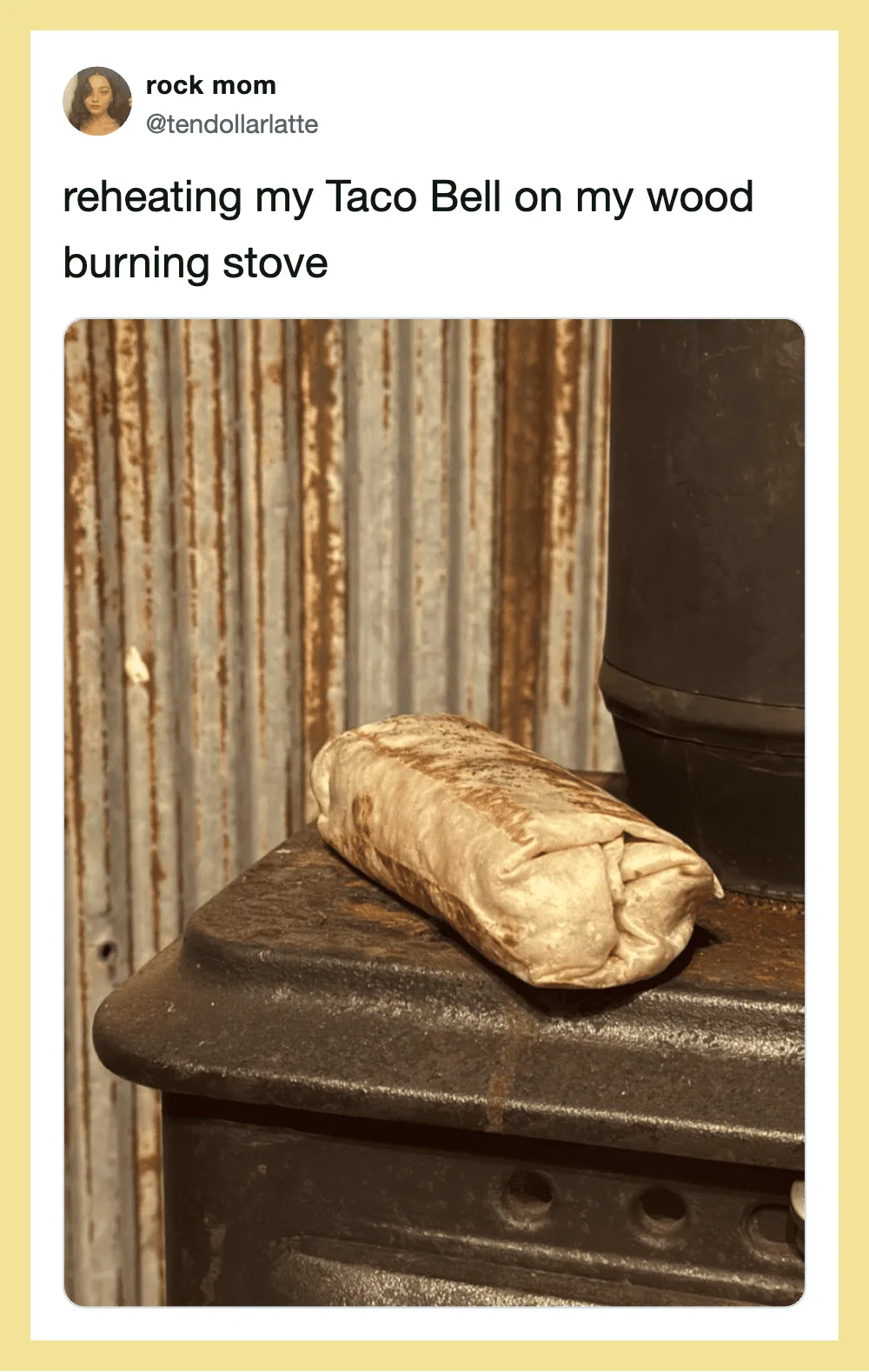 Taco Bell burrito reheated on a wood burning stove with a rustic background.