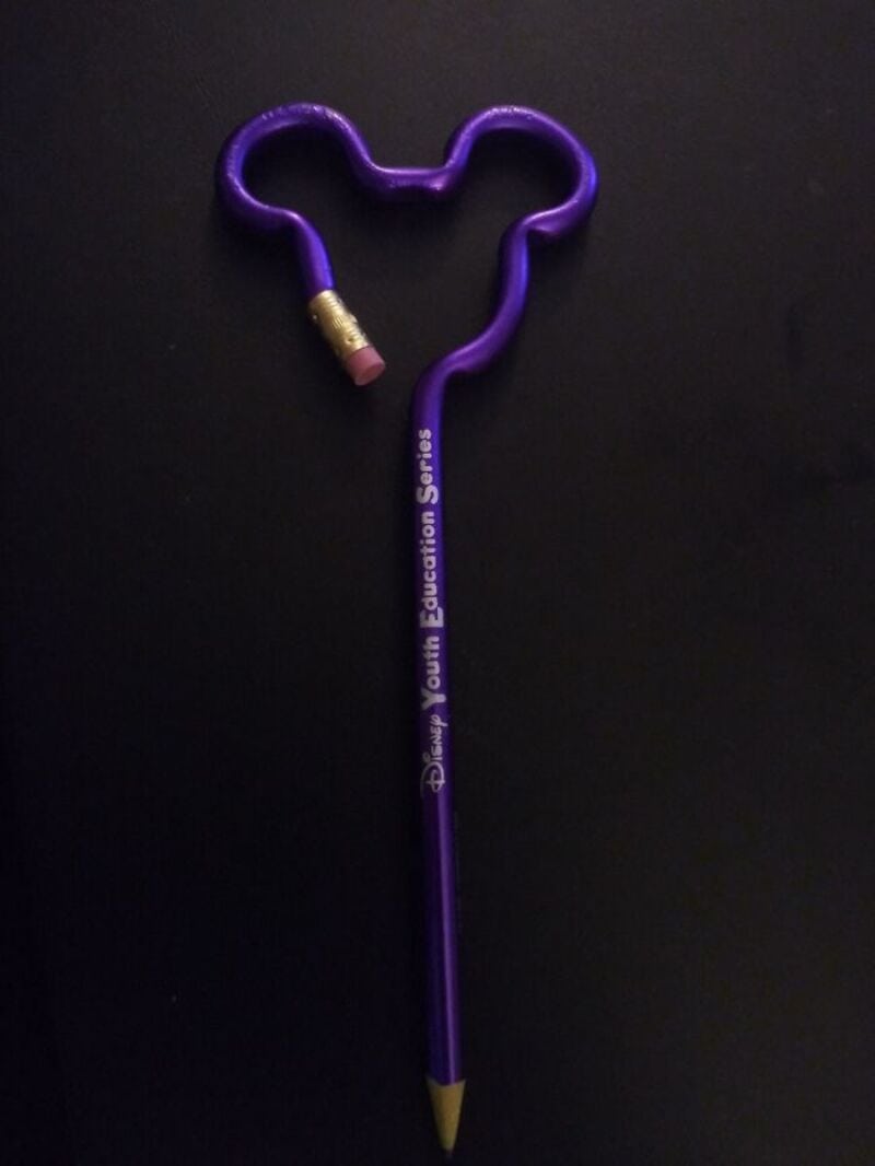 Purple pencil with a heart-shaped eraser and a broken eraser piece.