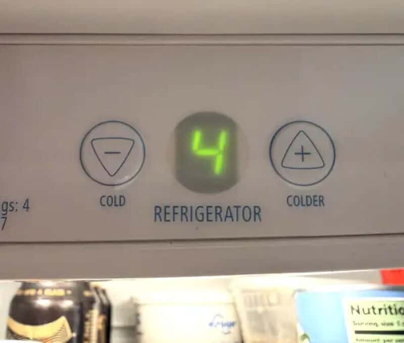 Refrigerator control panel showing temperature 4 and buttons for cold and colder.