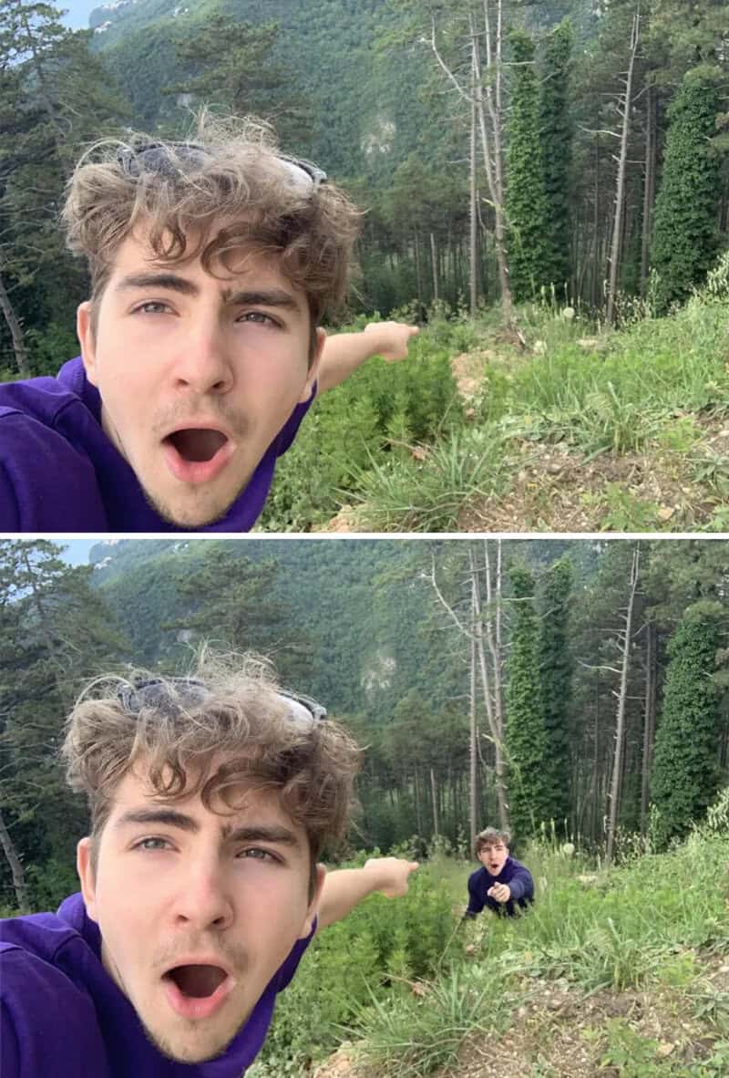 Young man taking a selfie with a small boy in a forested area.