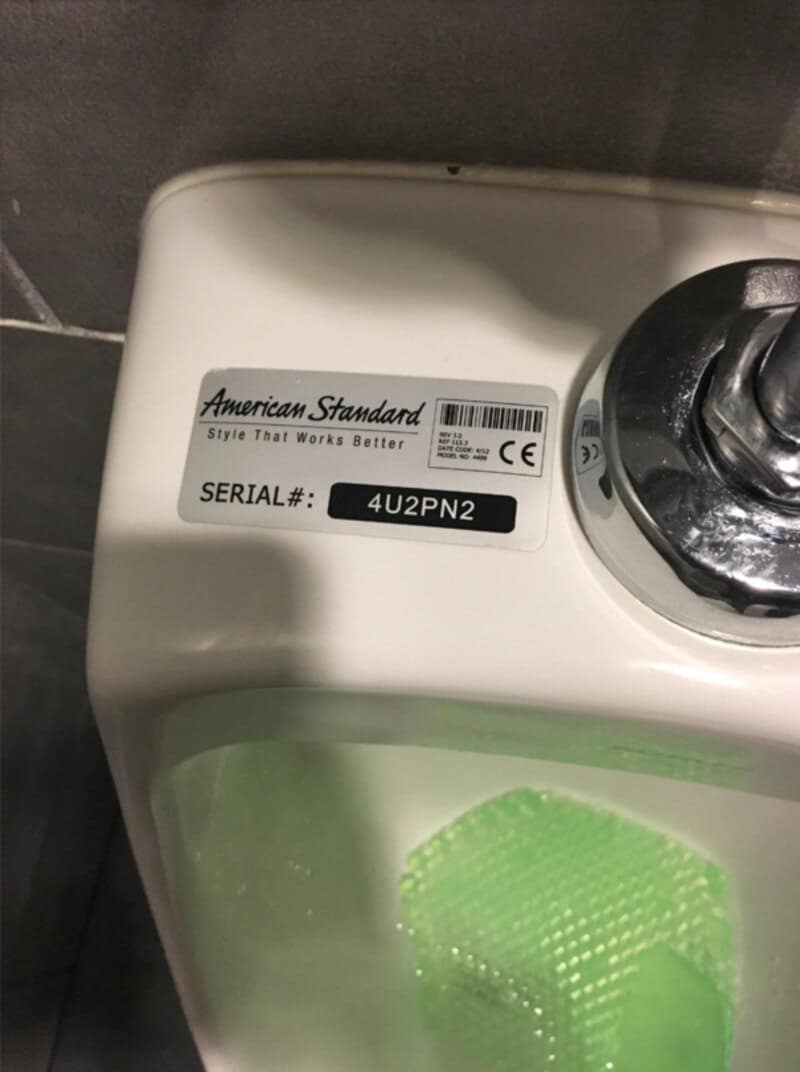 American Standard toilet with serial number 4U2PN2 in a bathroom.