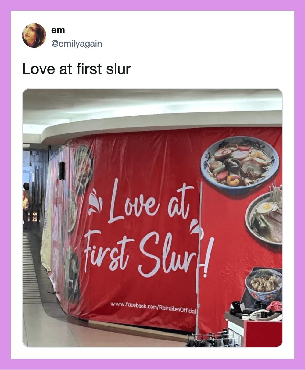 Love at first slur sign on a red background at a food court.