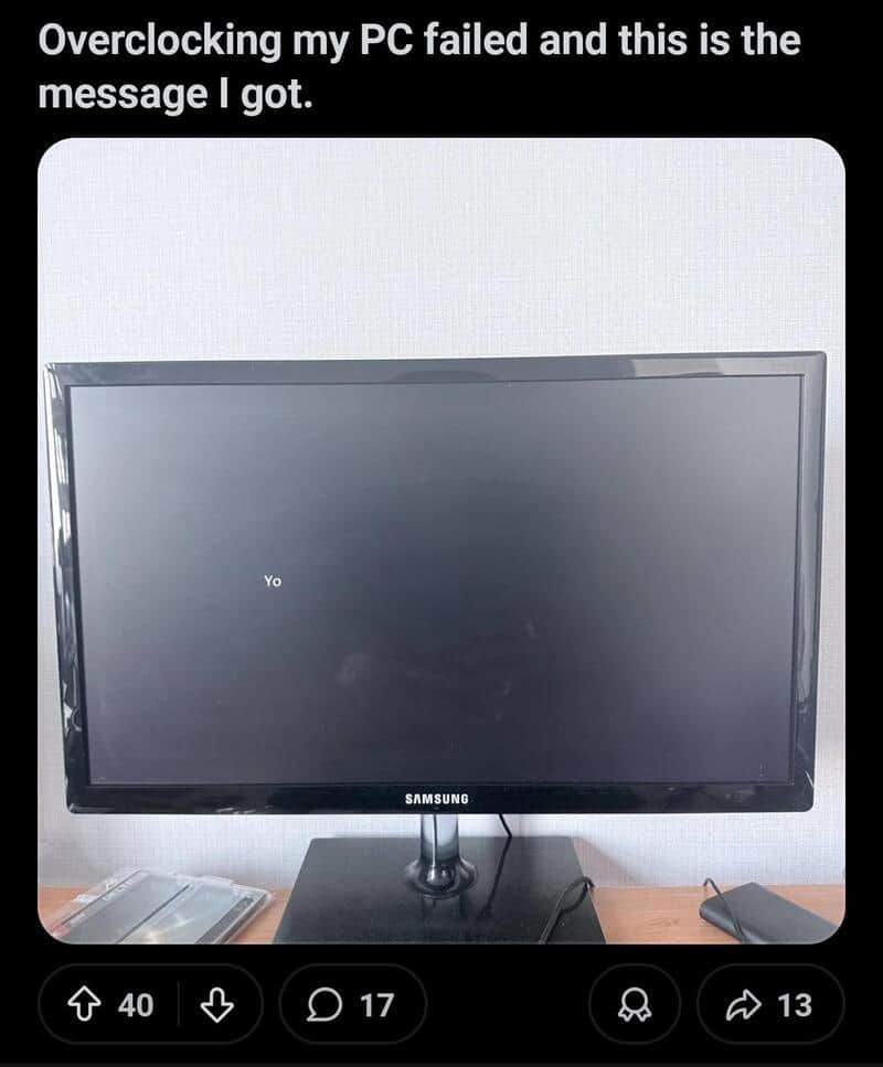 Overclocked PC with error message on screen, caption about failure.