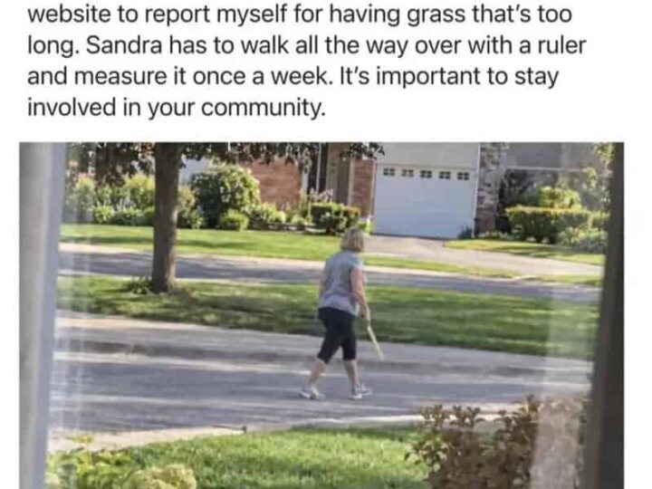 Woman walking with a ruler in a suburban neighborhood.
