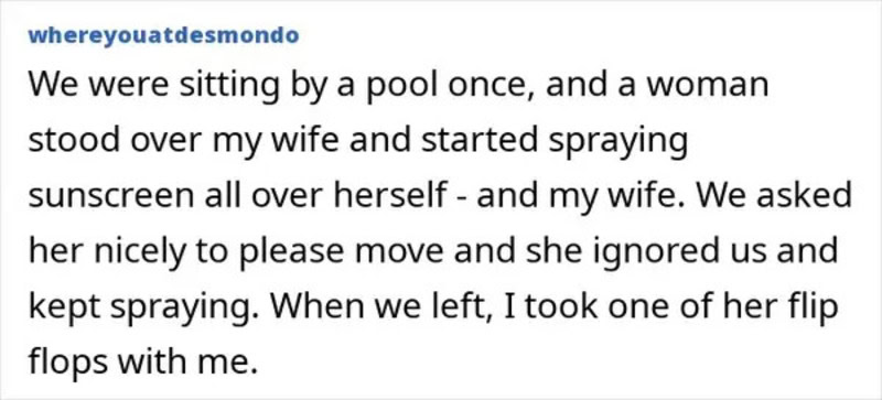 Woman spraying sunscreen over herself while sitting by a pool, ignored by others.