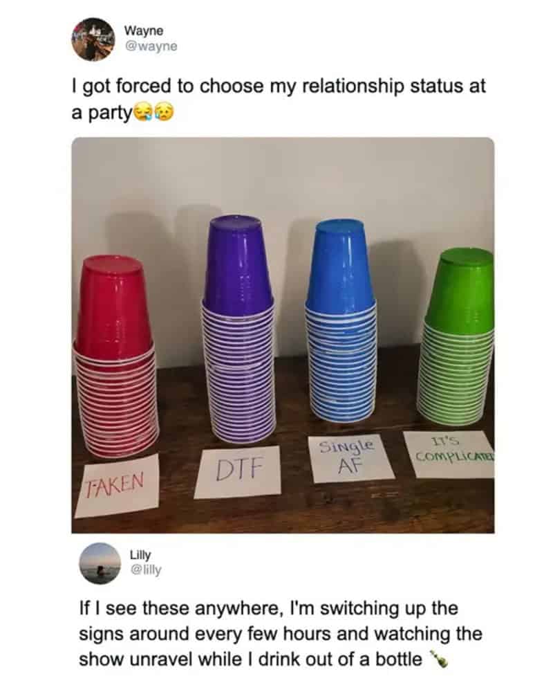 Four plastic cups labeled 'TAKEN', 'DTF', 'Single AF', and 'IT'S COMPLICATED' on a table.